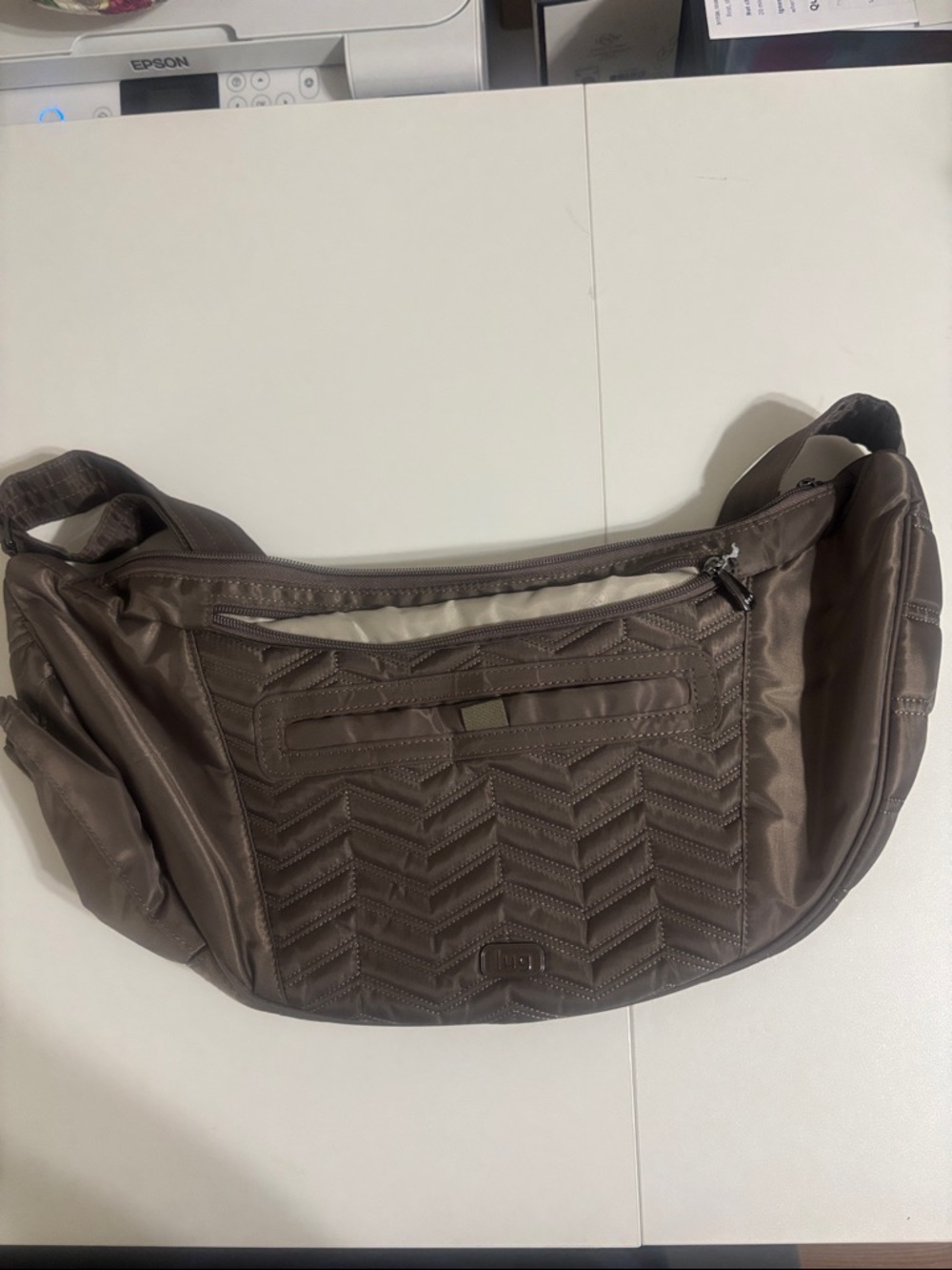 Lug Boomerang Sling Crossbody Bag in Brushed Walnut.